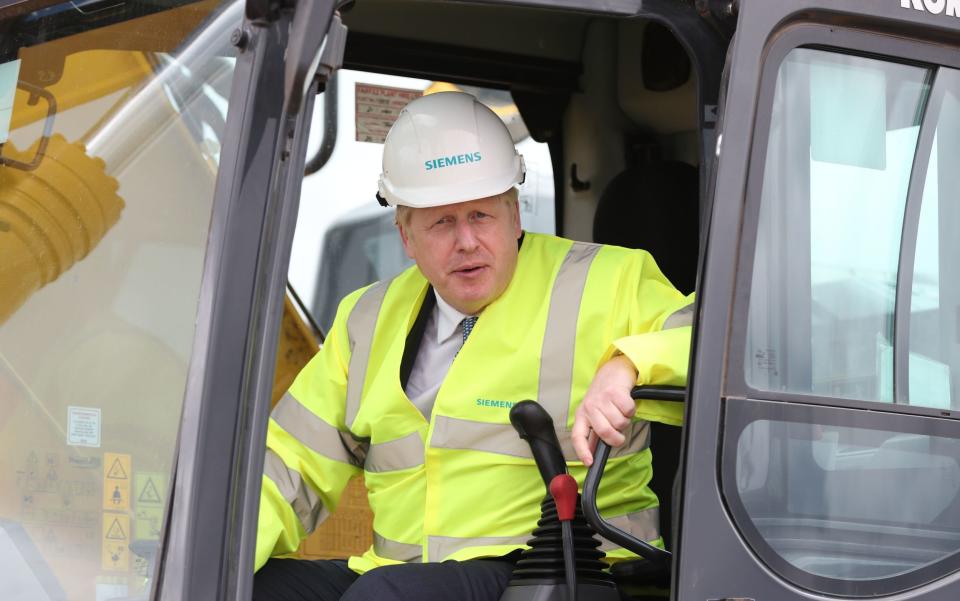 Prime Minister Boris Johnson in the cab of a digger - Peter Byrne/PA Wire