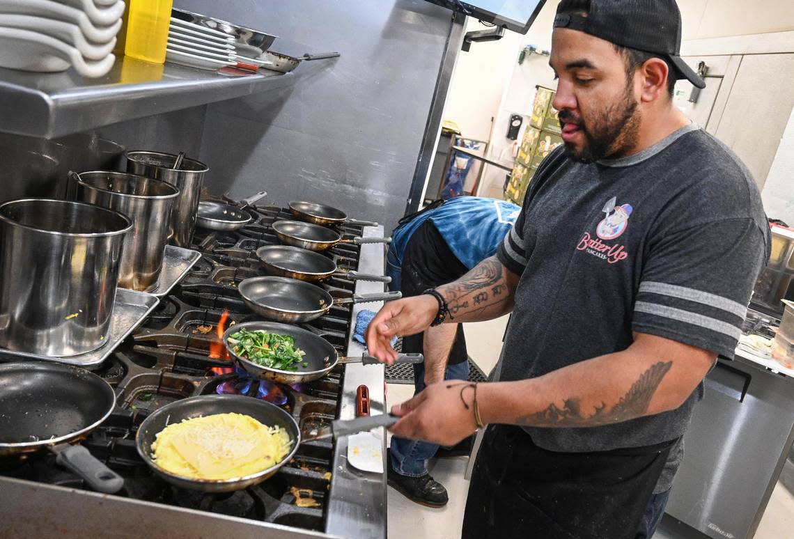 “Kitchen boss” Hector Lopez works on an omelet in the kitchen of the new Batter Up Pancakes location on Herndon and Fowler avenues in Clovis on Wednesday, Feb. 22, 2023.