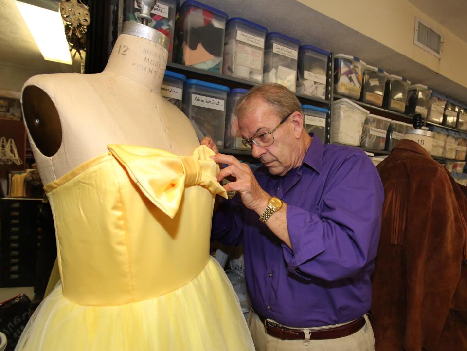 Costume designer B.G. FitzGerald working on a dress for a 2012 production of "The Best Little Whorehouse in Texas" at the Ocala Civic Theatre.