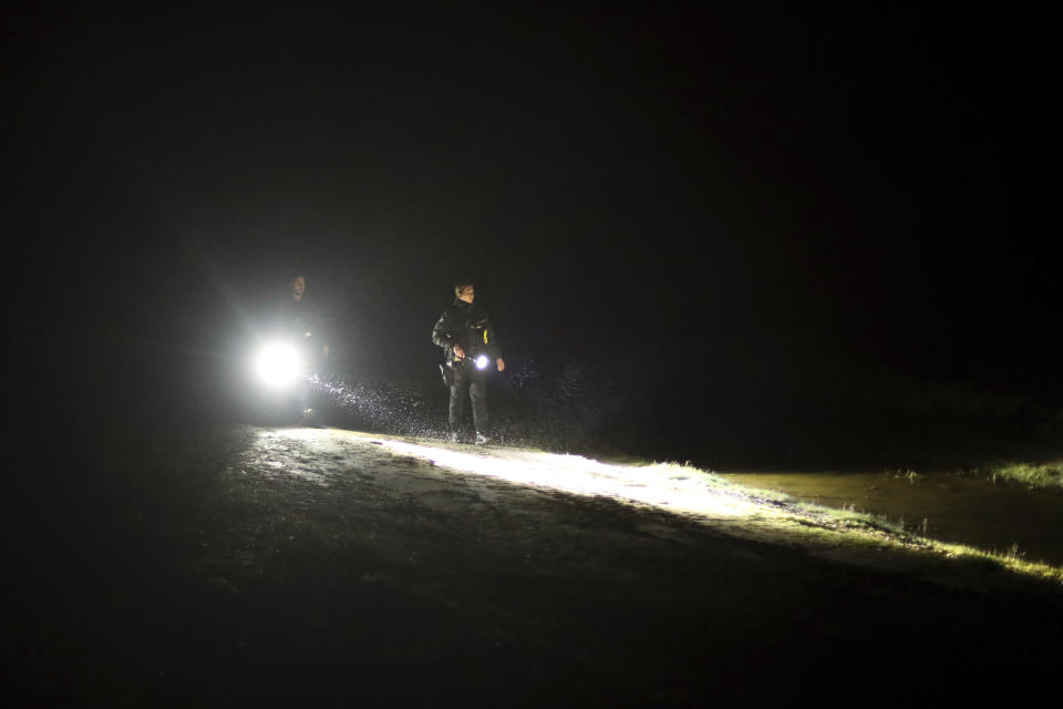 Police officers patrol on a beach near Calais, northern France, on Saturday, Feb. 01, 2020. Britain officially leaves the European Union on Friday. (AP Photo/Thibault Camus)