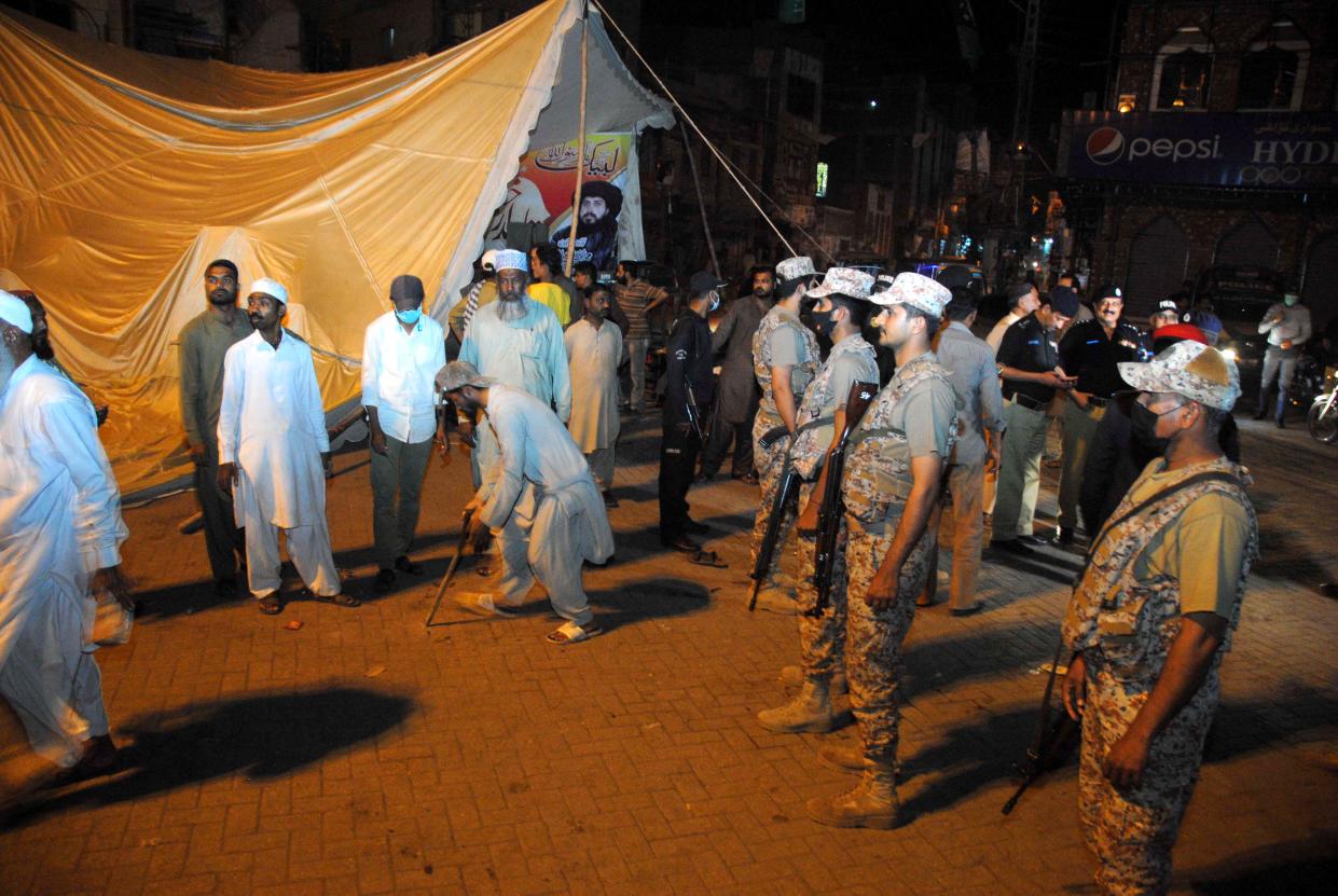 <p>Pakistani security officials remove the protest camp set up by supporters of Islamic political party Tehreek-e-Labbaik Pakistan (TLP) following violent anti-France protests, in Hyderabad, Pakistan</p> (EPA)