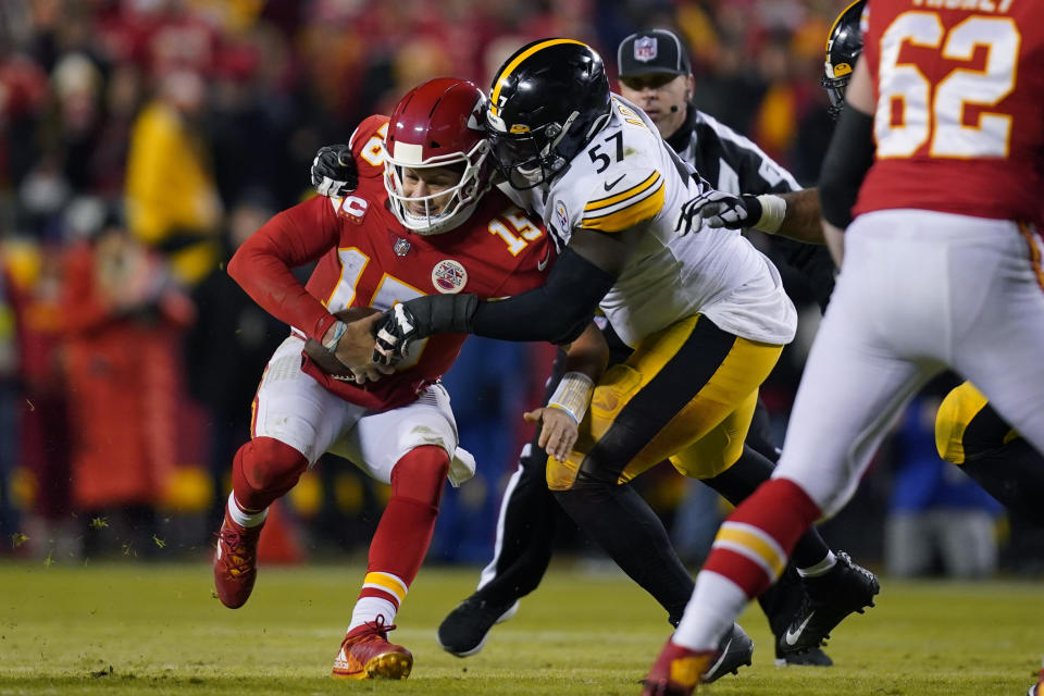 Kansas City Chiefs quarterback Patrick Mahomes (15) is sacked by Pittsburgh Steelers defensive tackle Montravius Adams (57) during the second half of an NFL wild-card playoff football game, Sunday, Jan. 16, 2022, in Kansas City, Mo. (AP Photo/Ed Zurga)