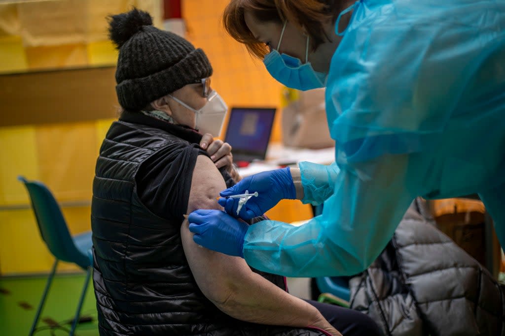 File photo: A woman receives a Covid vaccine in Prague, Czech Republic, 18 March 2021 (EPA-EFE)