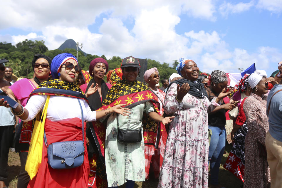 Supporters of the so-called Wuambushu operation that aims at expelling migrants, destroying slums and eradicating violence gather at a soccer stadium in Chirongui, in the French Indian Ocean territory of Mayotte, Thursday, April 27, 2023. France is facing a migration quagmire on the island territory of Mayotte off Africa’s east coast. The government sent in 2,000 troops and police to carry out mass expulsions, destroy slums and eradicate violent gangs. But the operation has become bogged down and raised concerns of abuse, aggravating tensions between local residents and immigrants from the neighboring country of Comoros. (AP Photo/Gregoire Merot)