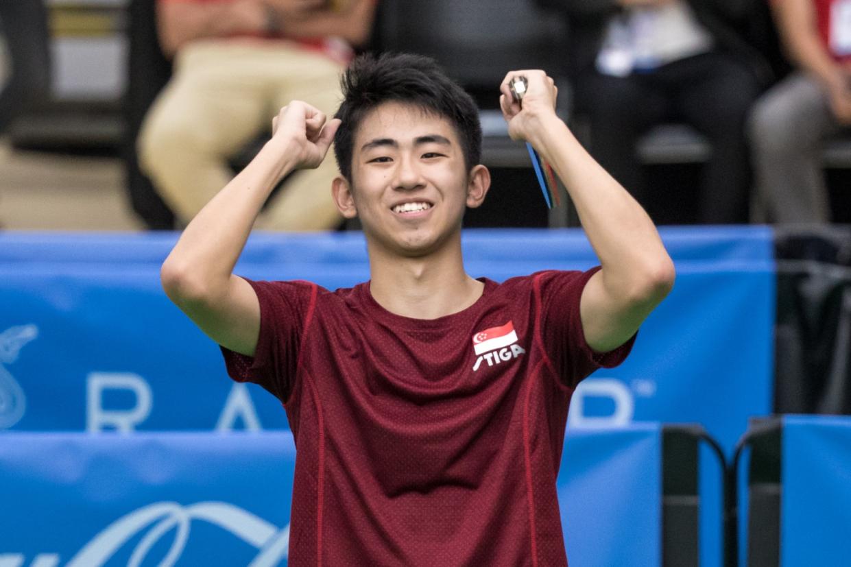 Singapore paddler Koen Pang raises his arms in triumph after beating compatriot Clarence Chew for the men's singles gold at the SEA Games. (PHOTO: Sport Singapore)