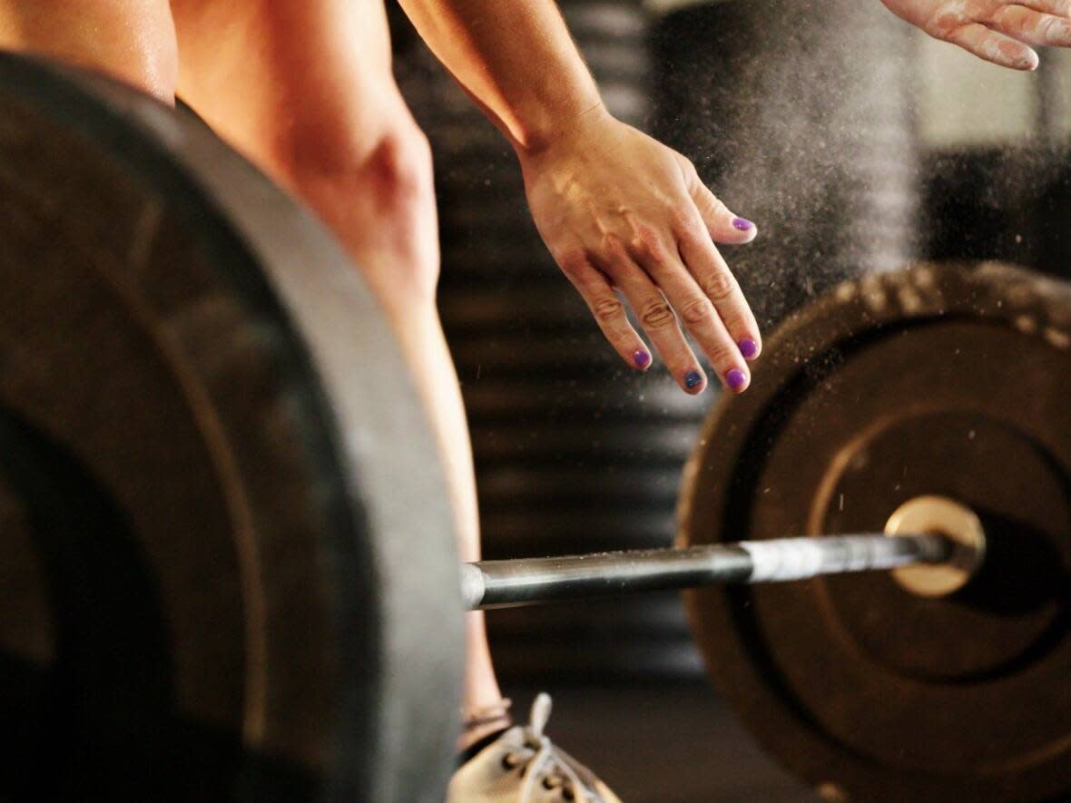 A group recently protested the policy that allowed a transgender woman to compete in the Canadian Powerlifting Championships' female sport category. (International Consortium of Female Sport - image credit)