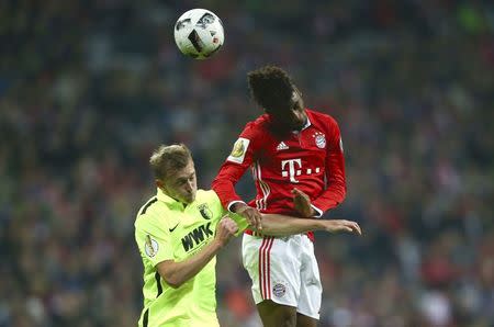 Football Soccer - Bayern Munich v FC Augsburg - German Cup (DFB Pokal) - Allianz Arena, Munich, Germany - 26/10/16 - Bayern's Kingsley Coman and Augsburg's Georg Teigl in action. REUTERS/Michael Dalder