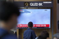 A TV screen showing a news program reporting about North Korea's missile launch with file footage, is seen at the Seoul Railway Station in Seoul, South Korea, Thursday, Oct. 6, 2022. North Korea launched two ballistic missiles toward its eastern waters on Thursday, as the United States redeployed one of its aircraft carriers near the Korean Peninsula in response to the North's recent launch of a powerful missile over Japan. (AP Photo/Lee Jin-man)