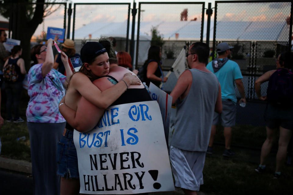 <p>Supporters of Senator Bernie Sanders embrace at the perimeter walls of the 2016 Democratic National Convention in Philadelphia, Pennsylvania, July 26, 2016. (Photo: Adrees Latif/Reuters)</p>