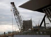 Workers are seen at the construction site of the Tokyo Aquatics Centre for Tokyo 2020 Olympic and Paralympic games in Tokyo, Japan February 12, 2019. REUTERS/Issei Kato