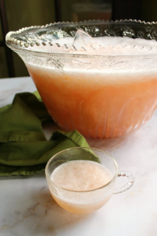 <p>This fun slushy punch is family friendly and the perfect excuse to bring out that punch bowl.</p><p><strong>Get the recipe: </strong><a href="https://www.cookingwithcarlee.com/2015/04/grandma-rees-peach-punch.html" rel="nofollow noopener" target="_blank" data-ylk="slk:Peach Punch;elm:context_link;itc:0;sec:content-canvas" class="link rapid-noclick-resp"><strong>Peach Punch</strong></a></p>