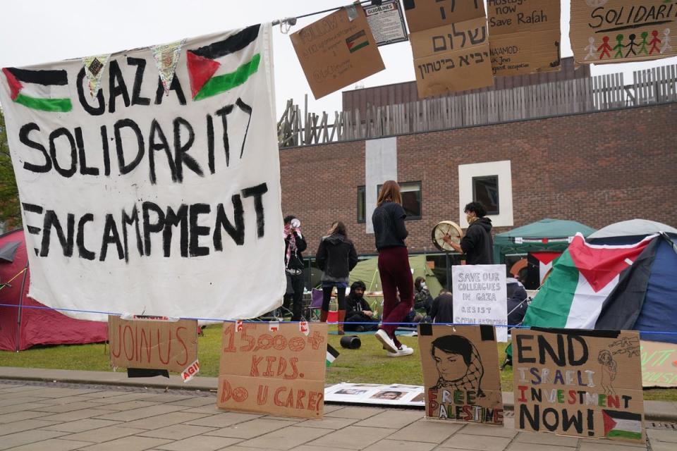 Signs surround a student encampment on the grounds of Newcastle University (Owen Humphreys/PA Wire)
