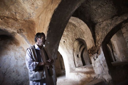 Libyan Omar Aboud, from the ancient Amazigh (Berber) tribe, stands inside one of the surviving synagogues in the Berber village of Yafran in western Libya on July 13. For centuries, Jews lived among the Berbers of Yafran, observing the Sabbath at the synagogue of Ghriba, but they suddenly left 63 years ago, and their land in Libya remains untouched