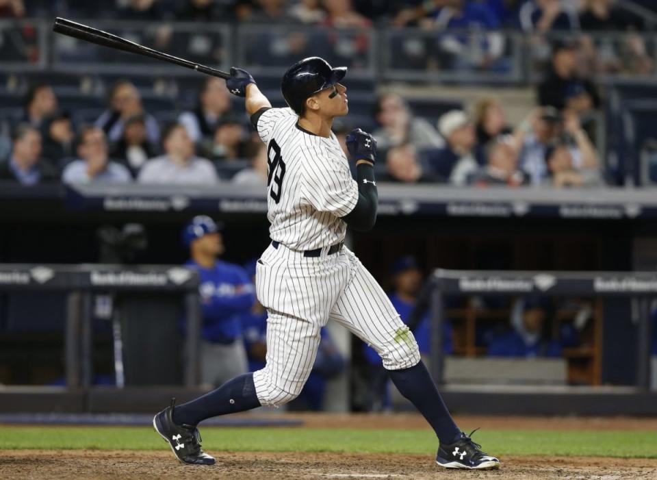 New York Yankees' Aaron Judge watches his three-run home run off Toronto Blue Jays relief pitcher Jason Grilli during the seventh inning of a baseball game in New York, Tuesday, May 2, 2017. It was Judge's second home run of the game. (AP Photo/Kathy Willens)