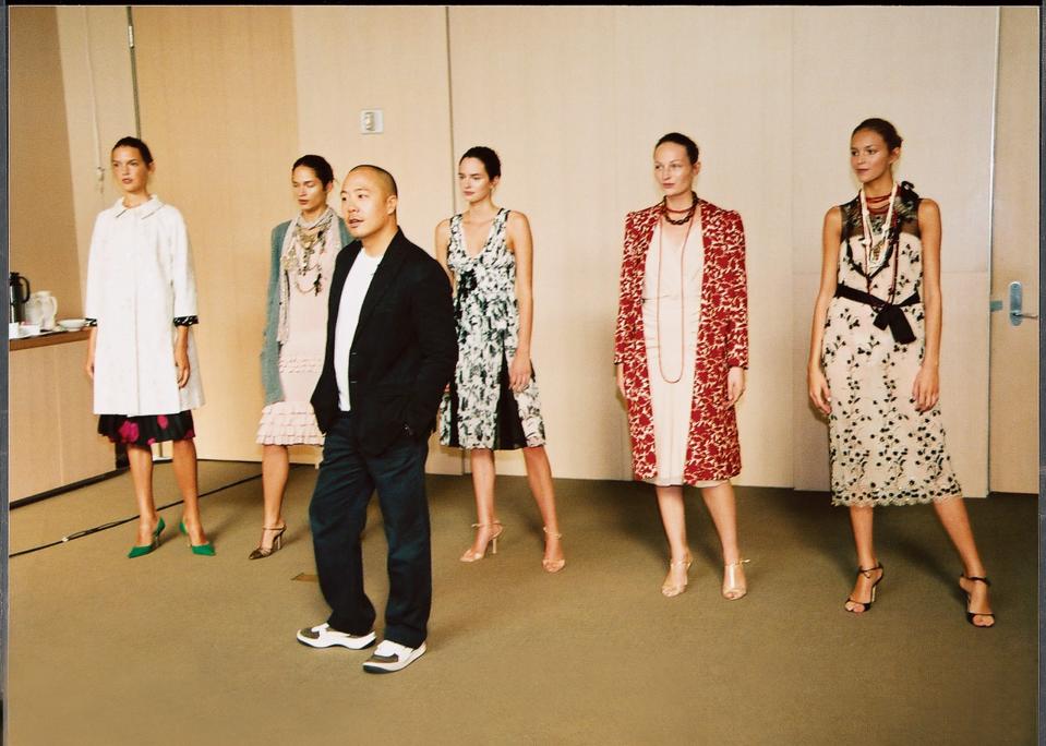 Lam is flanked by models at his CFDA/Vogue Fashion Fund presentation.