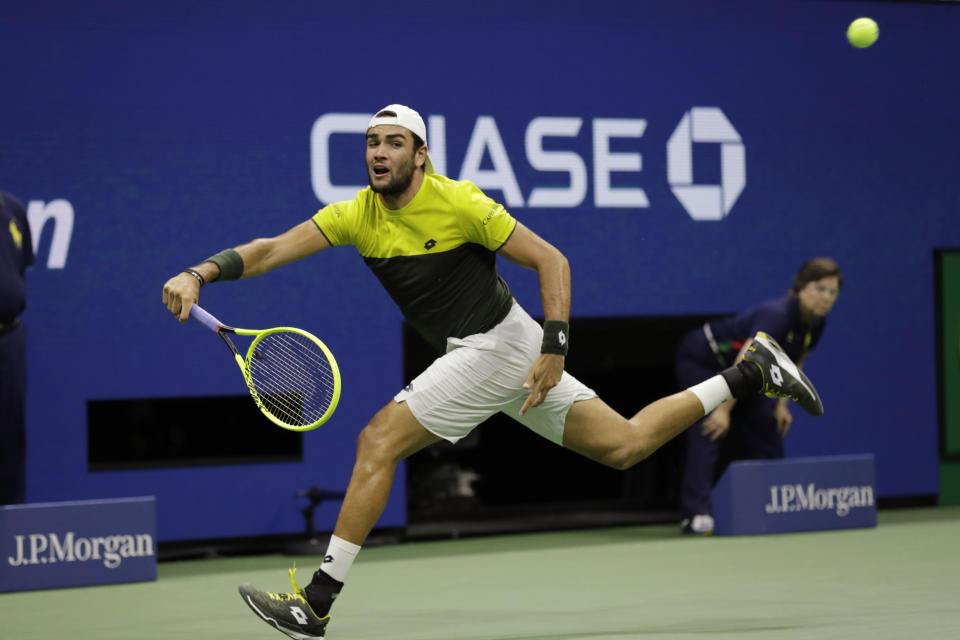 Matteo Berrettini, of Italy, returns a shot to Rafael Nadal, of Spain, during the men's singles semifinals of the U.S. Open tennis championships Friday, Sept. 6, 2019, in New York. (AP Photo/Adam Hunger)