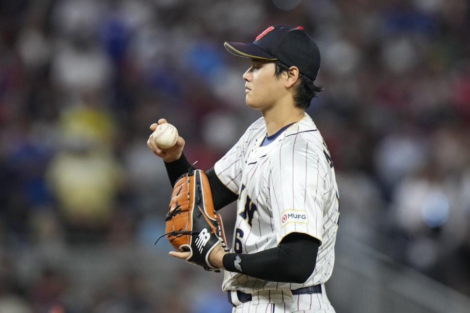 Shohei Ohtani pitches during ninth inning of a WBC game against the U.S.