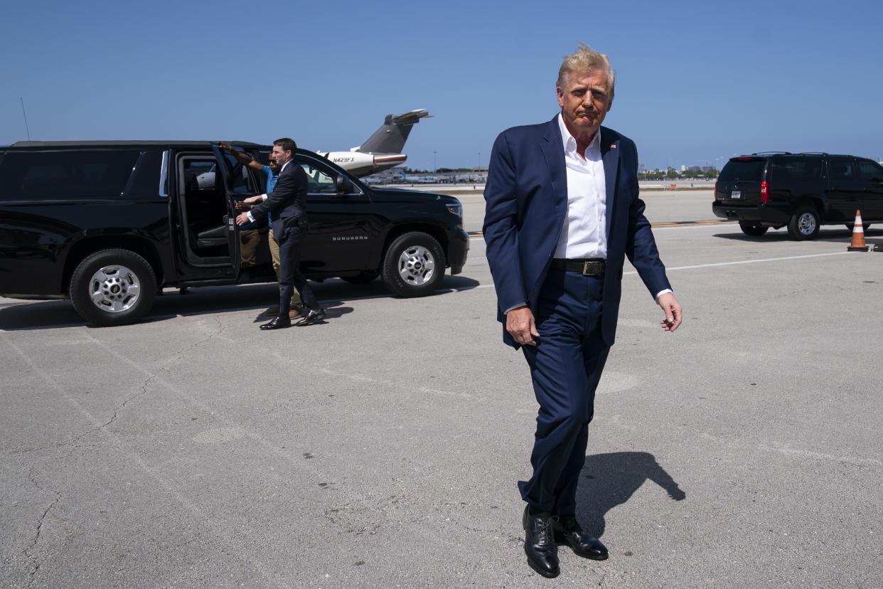 FILE - Former President Donald Trump arrives to boars his airplane for a trip to a campaign rally in Waco, Texas, at West Palm Beach International Airport, Saturday, March 25, 2023, in West Palm Beach, Fla. (AP Photo/Evan Vucci, File)