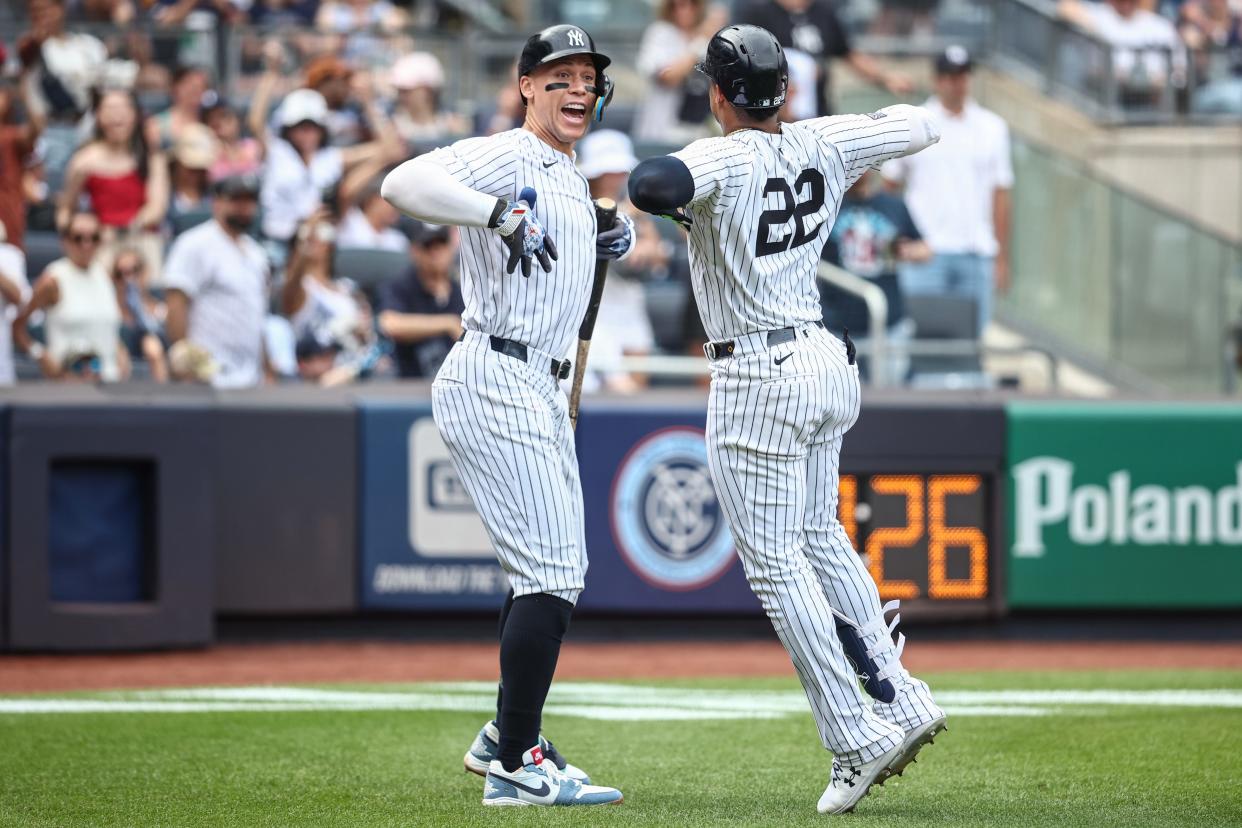 Jul 4, 2024; Bronx, New York, USA; New York Yankees right fielder Juan Soto (22) celebrates with designated hitter Aaron Judge (99) after hitting a two run home run in the seventh inning against the Cincinnati Reds at Yankee Stadium. Mandatory Credit: Wendell Cruz-USA TODAY Sports