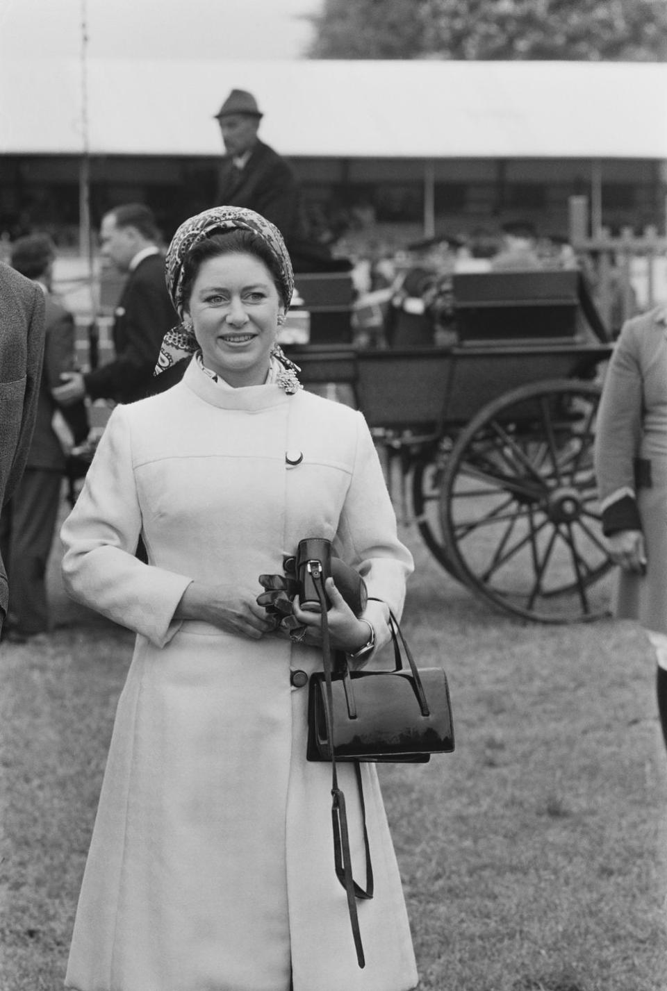 <p>Princess Margaret—and every other member of the royal family, TBH—always brought a purse with her whenever she went out, and this patent-leather number was no exception. The material was a prominent part of British fashion trends in the '60s and became even more popular in the following decade. </p>