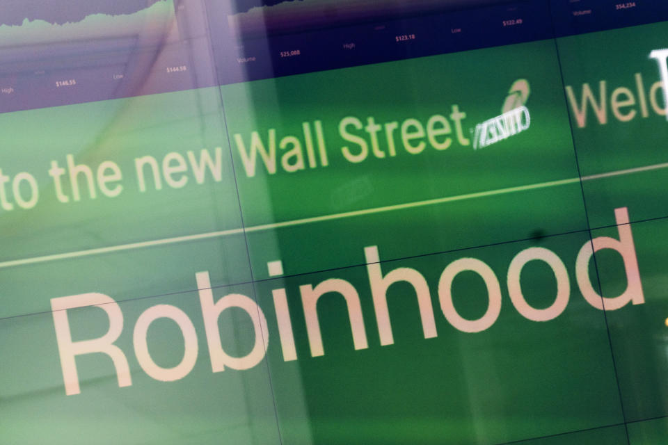 FILE - An electronic screen at Nasdaq displays Robinhood in New York's Times Square following the company's IPO, Thursday, July 29, 2021. Robinhood announced Tuesday, Oct. 5, 2021 that it’s offering 24/7 phone support for all its customers to cover almost every issue. It follows up on an announcement by Coinbase, which said last month it would launch 24/7 phone service by the end of the year for many customers.  (AP Photo/Mark Lennihan, File)
