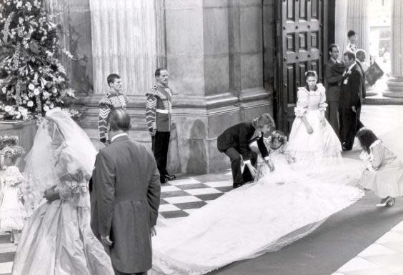 Bridesmaid India Hicks helps to unfold Princess Diana’s bridal train on the day of her wedding to Prince Charles (Rex Features)