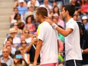 Sept 2, 2016; New York, NY, USA; Mikhail Youzhny of Russia retires while playing Novak Djokovic of Serbia on day five of the 2016 U.S. Open tennis tournament at USTA Billie Jean King National Tennis Center. Robert Deutsch-USA TODAY Sports