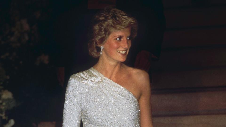 The Princess of Wales (1961 - 1997, later Diana, Princess of Wales) at a gala dinner at the National Gallery in Washington DC, 11th November 1985. She is wearing a white, crystal-beaded silk chiffon assymetric gown by Japanese designer Hachi