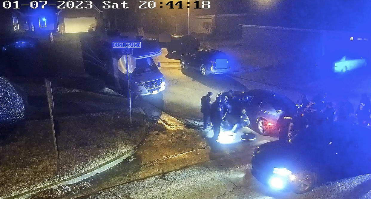 FILE - In this image from video released by the City of Memphis, paramedics stand near Tyre Nichols, seated leaning against a car, as police officers, right, stand at the scene following a brutal attack by Memphis police during a traffic stop on Jan. 7, 2023, in Memphis, Tenn. Nichols died days later. As Memphis police officers attacked Nichols, others held him down or milled about, even as he cried out in pain before his body went limp. Just like the attack on George Floyd in Minneapolis nearly three years ago, a simple intervention could have saved a life. (City of Memphis via AP, File)