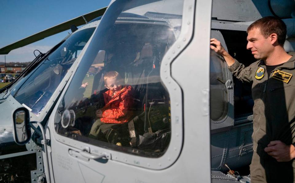 Bald Eagle Area elementary students check out the inside of the helicopters that was flown to the Veterans Day celebration on Thursday, Nov. 9, 2023. Abby Drey/adrey@centredaily.com