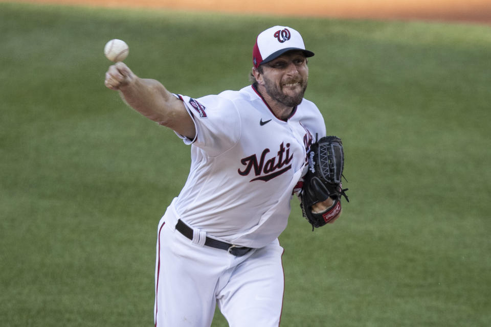 Washington Nationals starting pitcher Max Scherzer throws during the first inning of an exhibition baseball game against the Philadelphia Phillies at Nationals Park, Saturday, July 18, 2020, in Washington. (AP Photo/Alex Brandon)