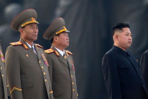 This photo, taken on April 13, shows North Korean military chief Ri Yong-Ho (L) and North Korean leader Kin Jong-Un (R), seen during a ceremony in Pyongyang. Ri has been relieved of all his posts due to illness, state media reported on July 16, in a surprise development that removes one of Kim's inner circle