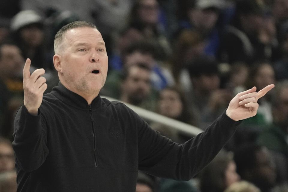 Denver Nuggets head coach Michael Malone reacts during the first half of an NBA basketball game Wednesday, Jan. 25, 2023, in Milwaukee. (AP Photo/Morry Gash)