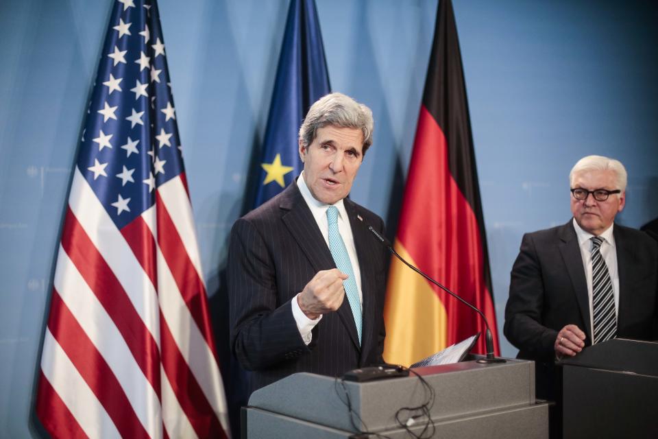 German Foreign Minister Frank-Walter Steinmeier, right, and his counterpart US Secretary Of State John Kerry, left, brief the media after a meeting at the Tegel airport in Berlin, Germany, Friday, Jan. 31, 2014. Kerry is on a stopover in the German capital en route to the Munich Security Conference. (AP Photo/Markus Schreiber)