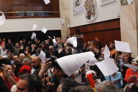 Protesters entered Macedonia's parliament after the governing Social Democrats and ethnic Albanian parties voted to elect an Albanian as parliament speaker in Skopje. Macedonia April 27, 2017. REUTERS/Ognen Teofilovski