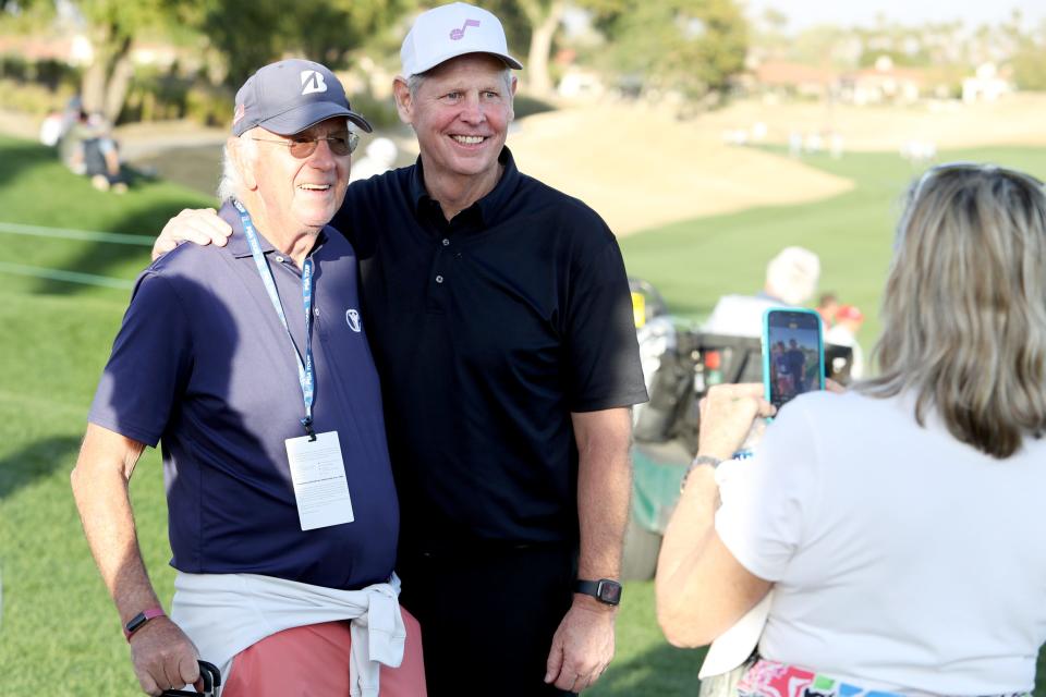 Danny Ainge, center, poses for a photograph with a fan after finishing on the 18th green of the PGA West Nicklaus Tournament Course during the first round of The American Express in La Quinta, Calif., on Thursday, Jan. 18, 2024.