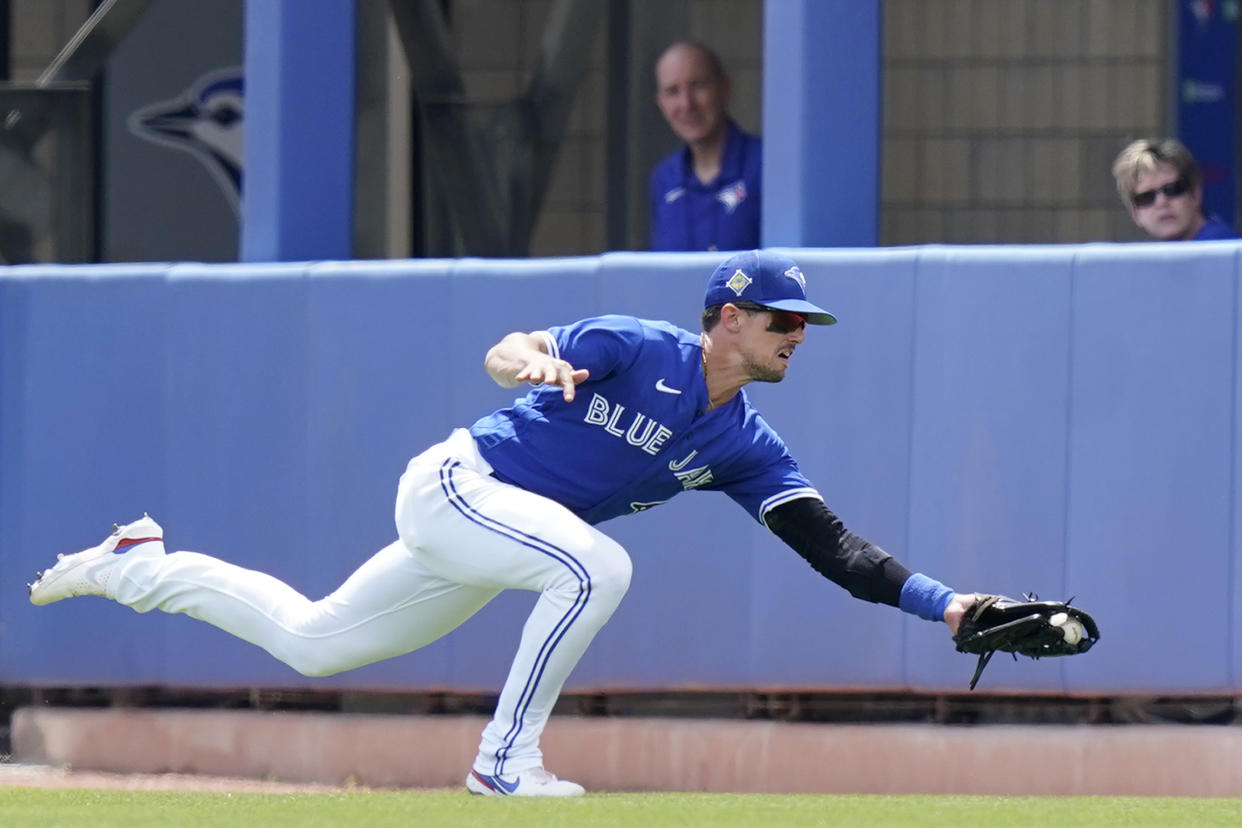 Toronto Blue Jays right fielder Cavan Biggio catches a fly ball hit by Detroit Tigers' Isaac Paredes during the second inning of a spring training baseball game, Thursday, March 31, 2022, in Dunedin, Fla. (AP Photo/Lynne Sladky)