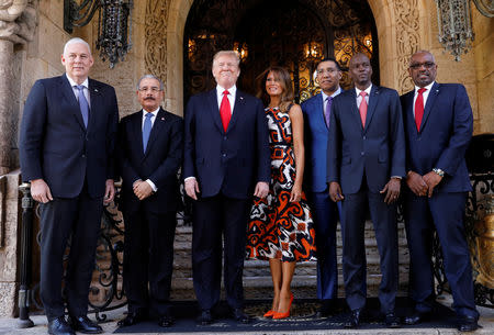 U.S. President Trump and first lady Melania Trump pose before a meeting with St Lucia Prime Minister Allen Chastanet, Dominican Republic President Danilo Medina, Jamaica Prime Minister Andrew Holness, Haiti President Jovenel Moise and Bahamas Prime Minister Hubert Minnis at Trump's Mar-a-Lago estate in Palm Beach, Florida, U.S., March 22, 2019. REUTERS/Kevin Lamarque