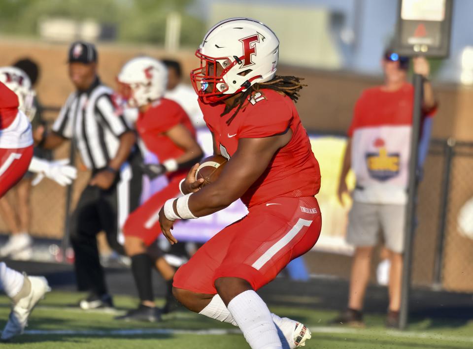 Kavi Bivins runs the ball for Fairfield during the Skyline Chili Crosstown Showdown against Wayne at Fairfield Stadium on Thursday, Aug. 18, 2022.