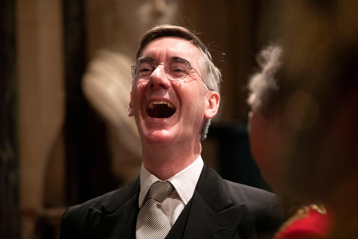 Britain's Leader of the House of Commons Jacob Rees-Mogg laughs whilst talking with someone before the arrival of Britain's Queen Elizabeth II in the Norman Porch at the Palace of Westminster and the Houses of Parliament for the State Opening of Parliament ceremony in London, Britain, October 14, 2019. Matt Dunham/Pool via REUTERS