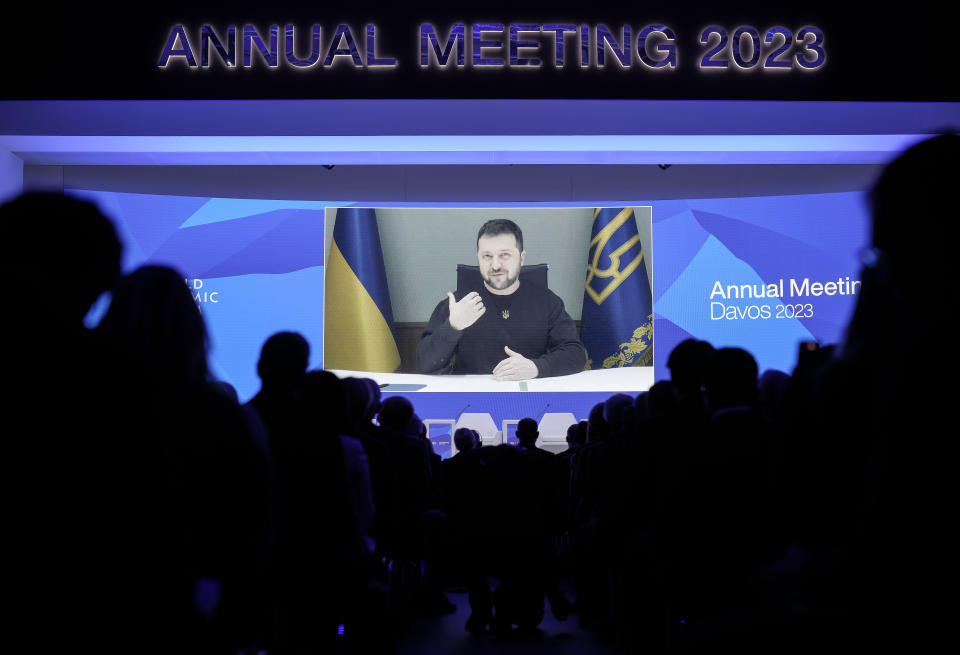 President Volodymyr Zelenskyy of Ukraine talks from a video screen to participants at the World Economic Forum in Davos, Switzerland on Wednesday, Jan. 18, 2023. The annual meeting of the World Economic Forum is taking place in Davos from Jan. 16 until Jan. 20, 2023. (AP Photo/Markus Schreiber)