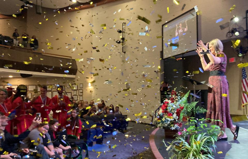 Tracie Snow, president of the Florida School for the Deaf and the Blind, smiles as confetti falls at the end of the commencement ceremony for deaf graduates on Friday.