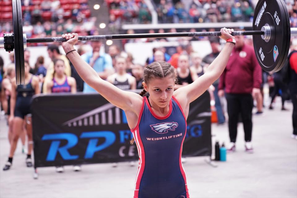 Centennial's Kendall Lopez competes in the snatch event as part of the Olympic lifts portion of the FHSAA Girls Weightlifting Championships that took place on Saturday, Feb. 18, 2023 at the RP Funding Center in Lakeland.