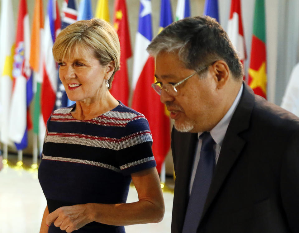 Australian Foreign Minister Julie Bishop, left, is escorted by acting Philippine Foreign Affairs Secretary Enrique Manalo prior to their meeting Thursday, March 16, 2017 in suburban Pasay city, south of Manila, Philippines. Bishop is on a two-day visit to discuss bilateral relations between the two countries which includes a meeting with President Rodrigo Duterte. (AP Photo/Bullit Marquez)