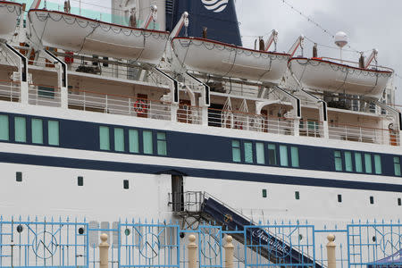 A 440-foot ship owned and operated by the Church of Scientology, SMV Freewinds, is docked under quarantine from a measles outbreak in port near Castries, St. Lucia, May 2, 2019. REUTERS/Micah George