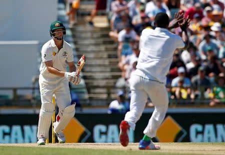 Cricket - Australia v South Africa - First Test cricket match - WACA Ground, Perth, Australia - 4/11/16. South Africa's Kagiso Rabada reaches to take a catch to dismiss Australia's Adam Voges at the WACA Ground in Perth. REUTERS/David Gray