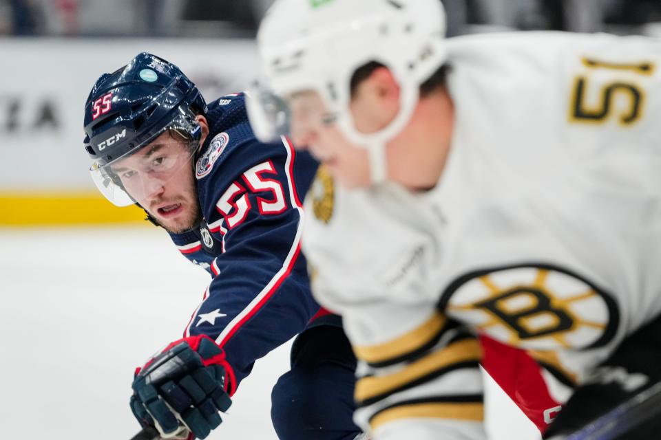 Nov 27, 2023; Columbus, Ohio, USA; Columbus Blue Jackets defenseman David Jiricek (55) defends Boston Bruins center Matthew Poitras (51) during the second period of the NHL game at Nationwide Arena.