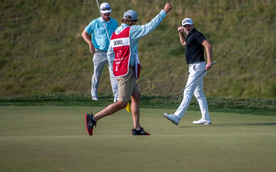 England's David Skinns fist-pumps in celebration after draining a long birdie putt on the 16th green during a playoff at the TPC Colorado Championship final round Sunday in Berthoud on July 11, 2021.