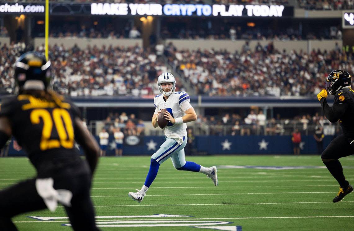 Dallas Cowboys quarterback Cooper Rush looks for a play against the Washington Commanders on Sunday, October 2, 2022, at AT&T Stadium in Arlington. Rush connected with Michael Gallup for a nine yard touchdown pass.