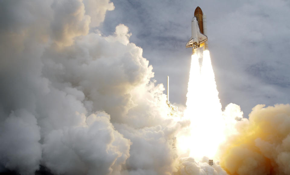 FILE - In this Friday, July 8, 2011 file photo, the space shuttle Atlantis lifts off from the Kennedy Space Center in Cape Canaveral, Fla. Atlantis was the 135th and last space shuttle launch for NASA. (AP Photo/John Raoux)